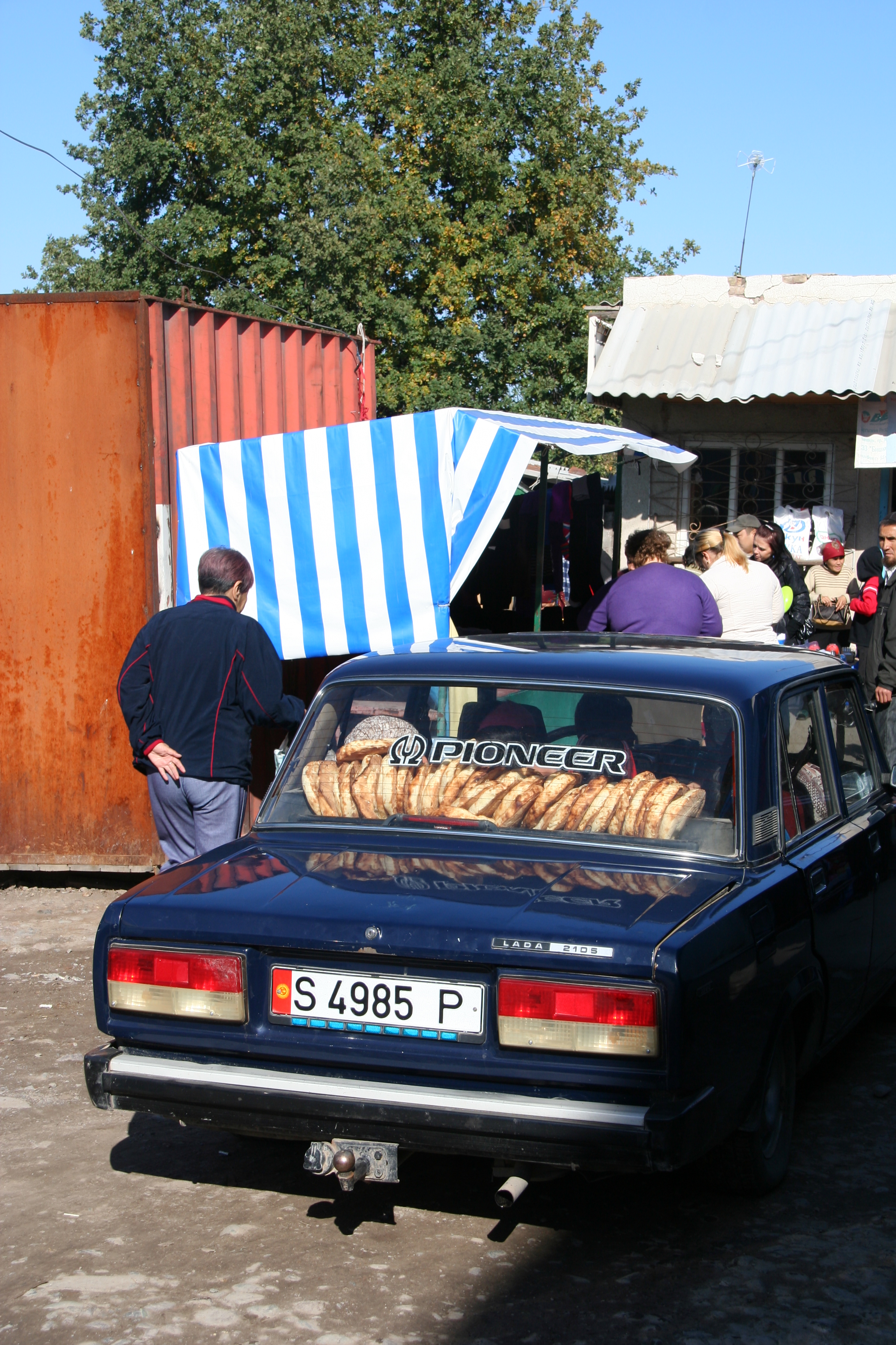 Lepyoshki (Kyrgyz loafs of bread) in a Lada